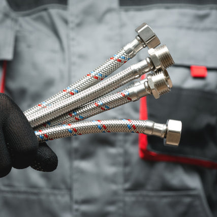 Plumbing SuppliesPlumber holding fittings in their hand