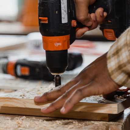  Power ToolsPower drill being used on a piece of wood