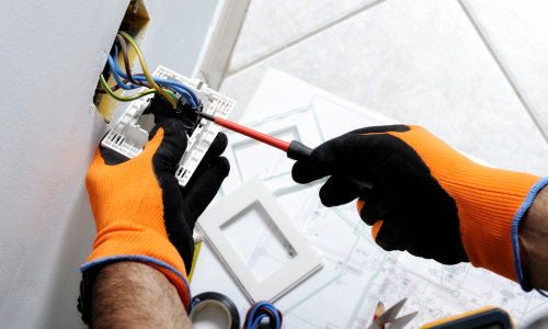 Electrician working on an outlet